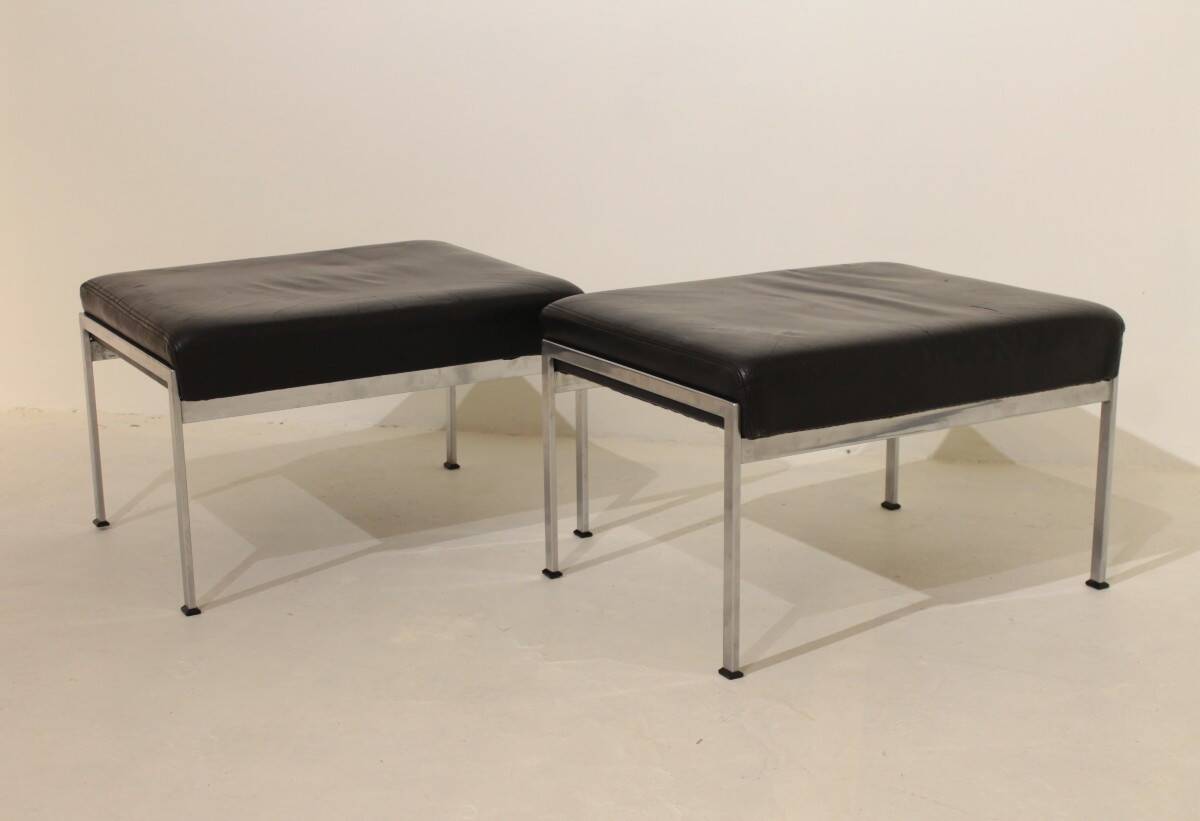 Pair of designer leather and brushed stainless steel footrests - Rob Parry