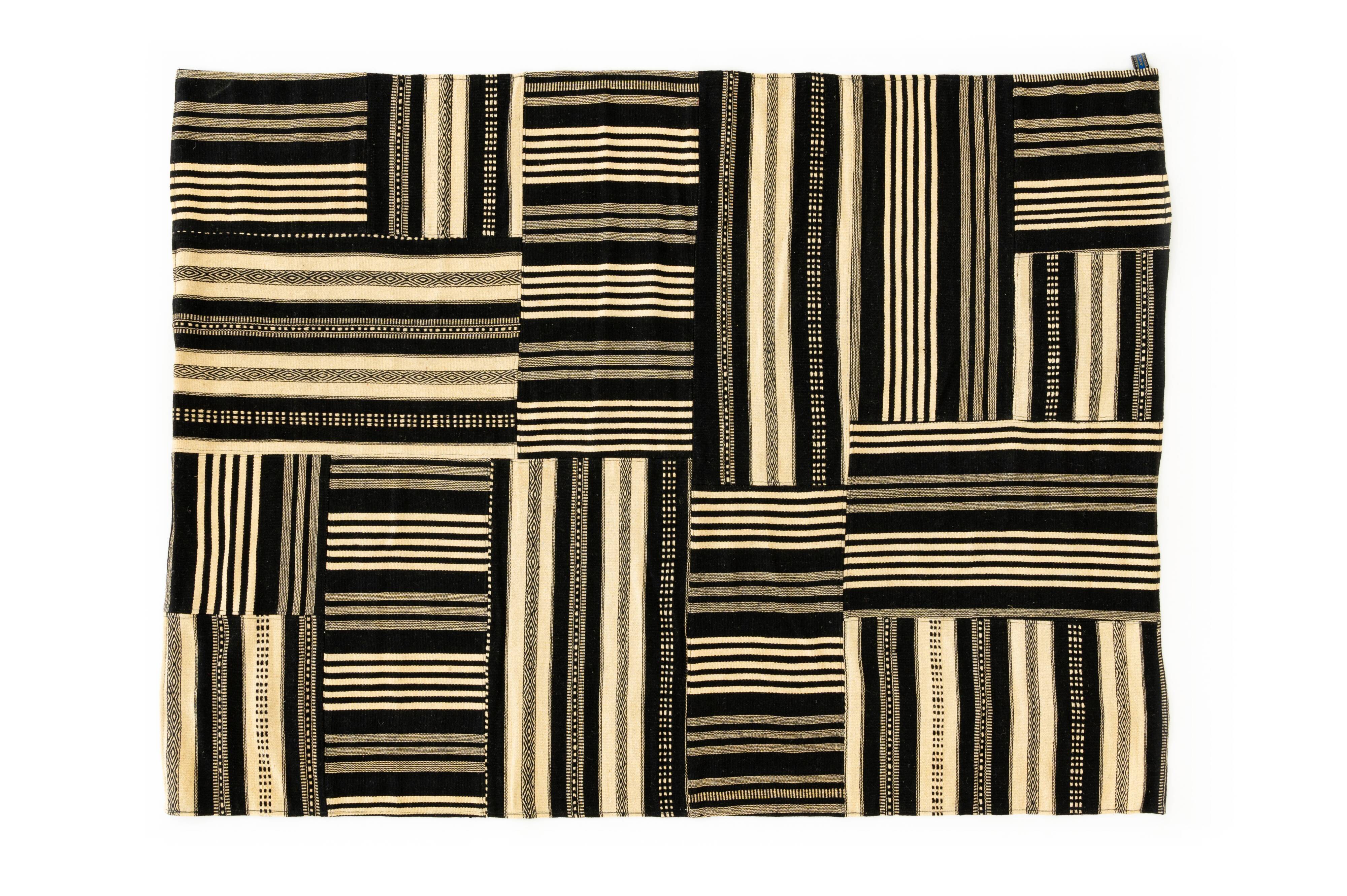 NOS Minimalist patchwork kilim by Axeco Svenska AB. 279 x 199 cm (110 x 78 in)