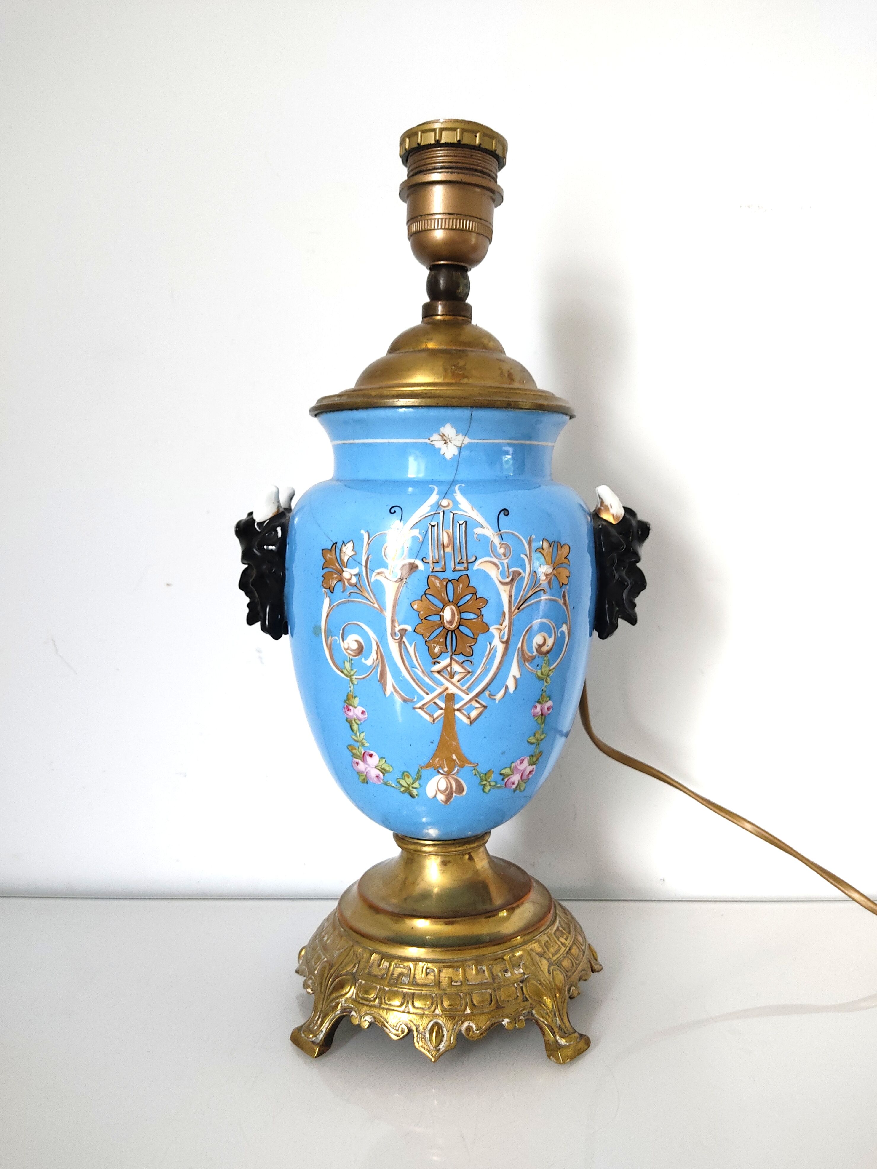 Lamp foot blue vase heads of fauna