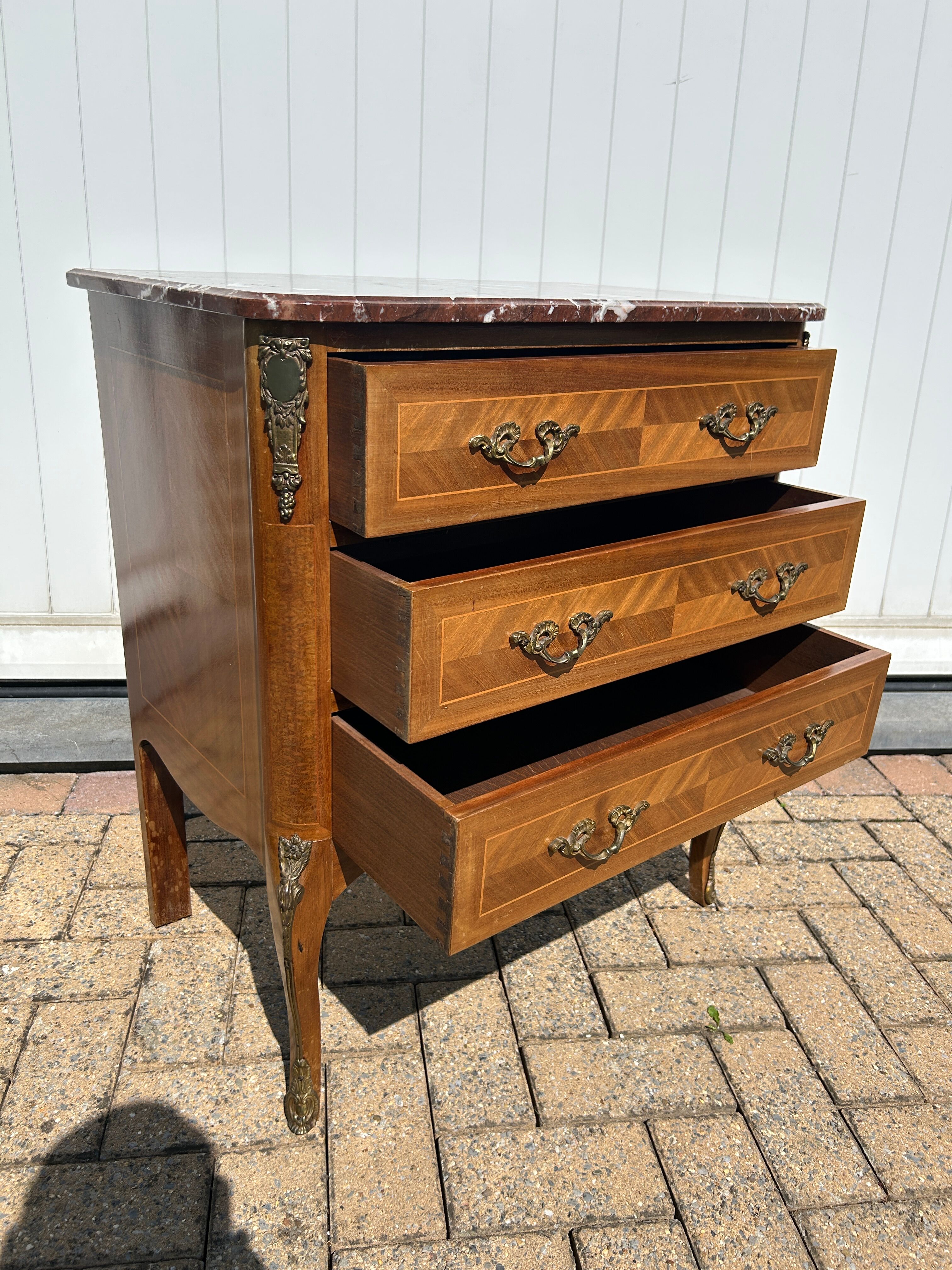 Marquetry commode in transitional style