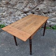 Vintage pine table with drop-leaf extension and turned beech legs, France, 1930s.