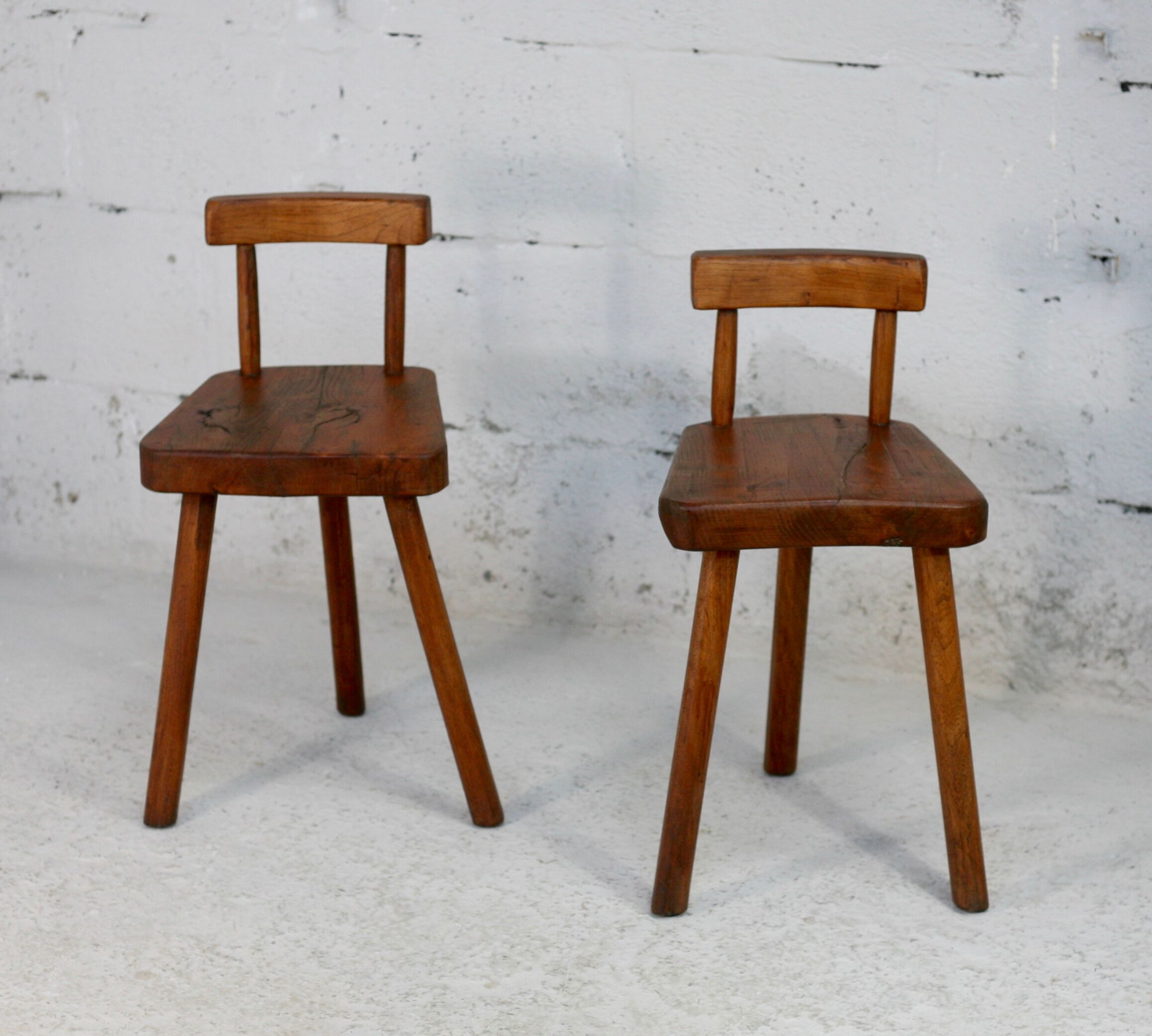 Pair of tripod stools with brutalist backrests, France, circa 1960