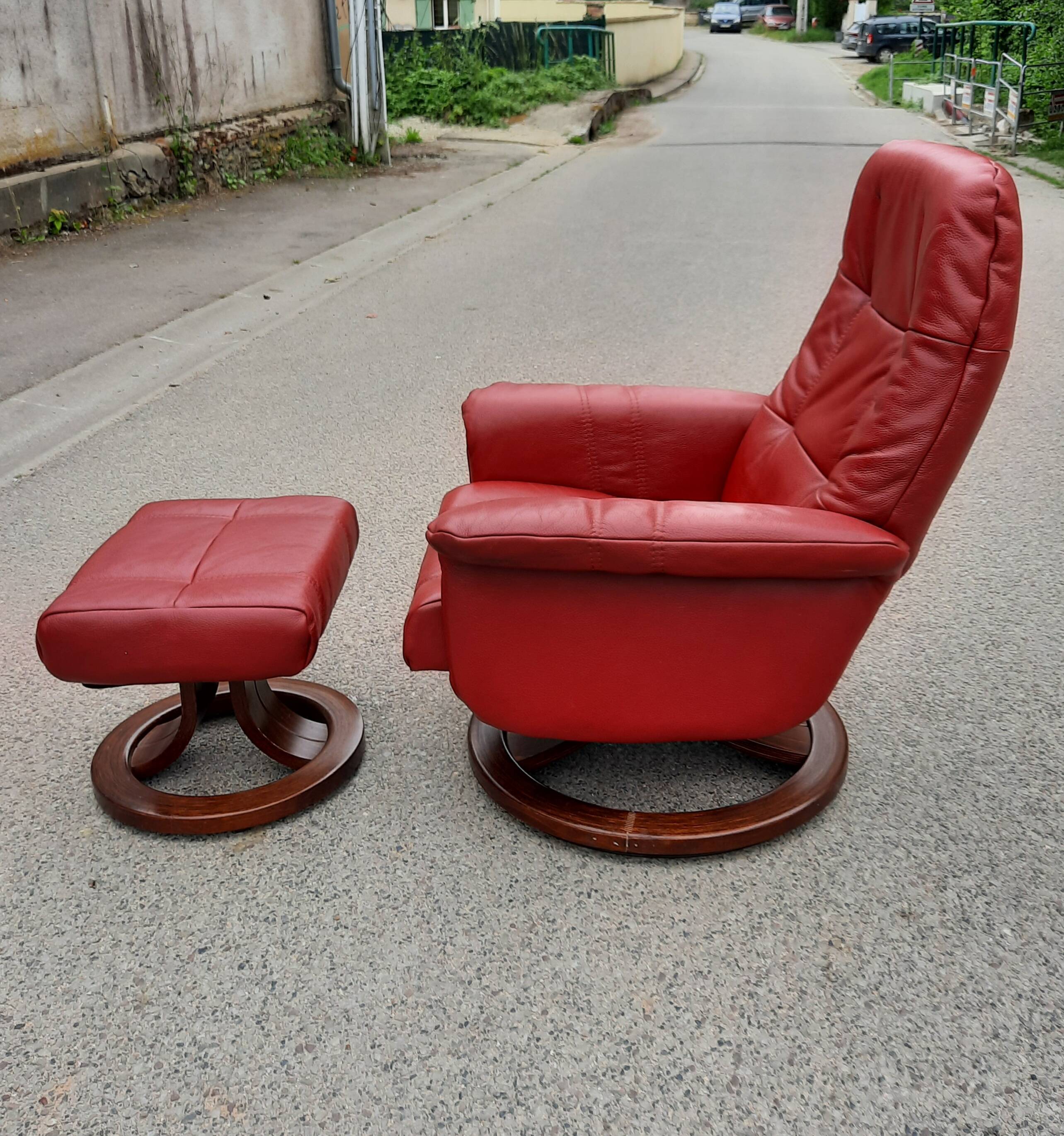 Red leather relax armchair and pouf