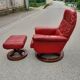 Red leather relax armchair and pouf
