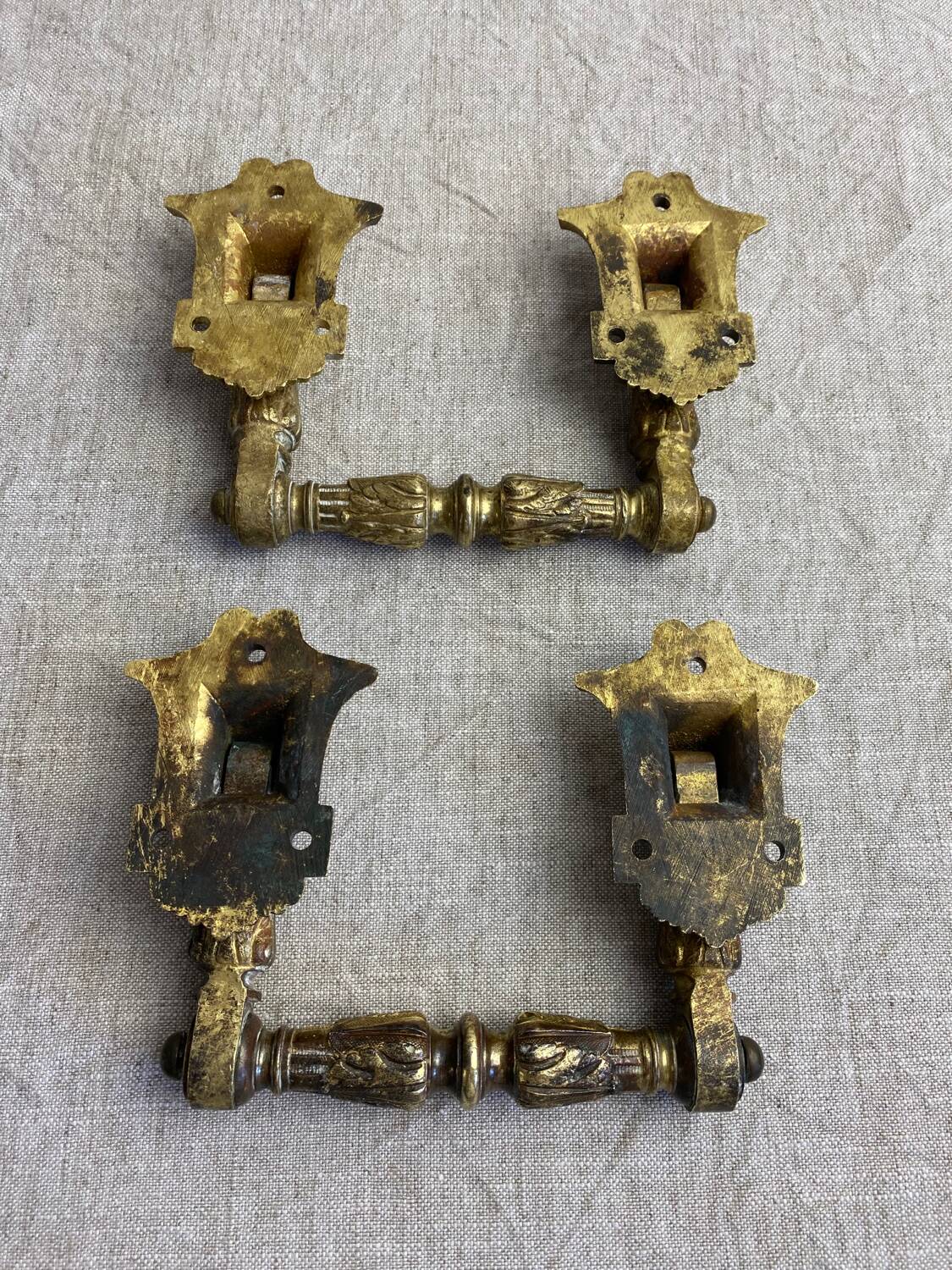 Articulated bronze handles