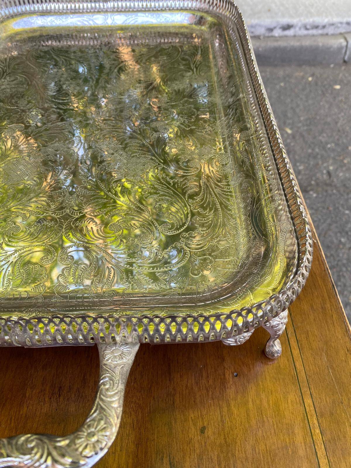 Sculpted silver serving tray