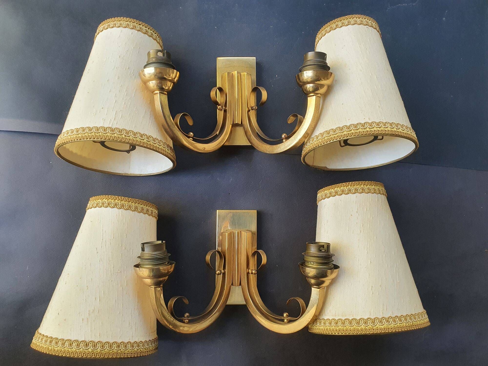 Pair of bronze wall sconces with 1940s Art Deco lampshades.