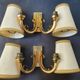 Pair of bronze wall sconces with 1940s Art Deco lampshades.