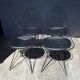Set of 4 Eames chairs in metal