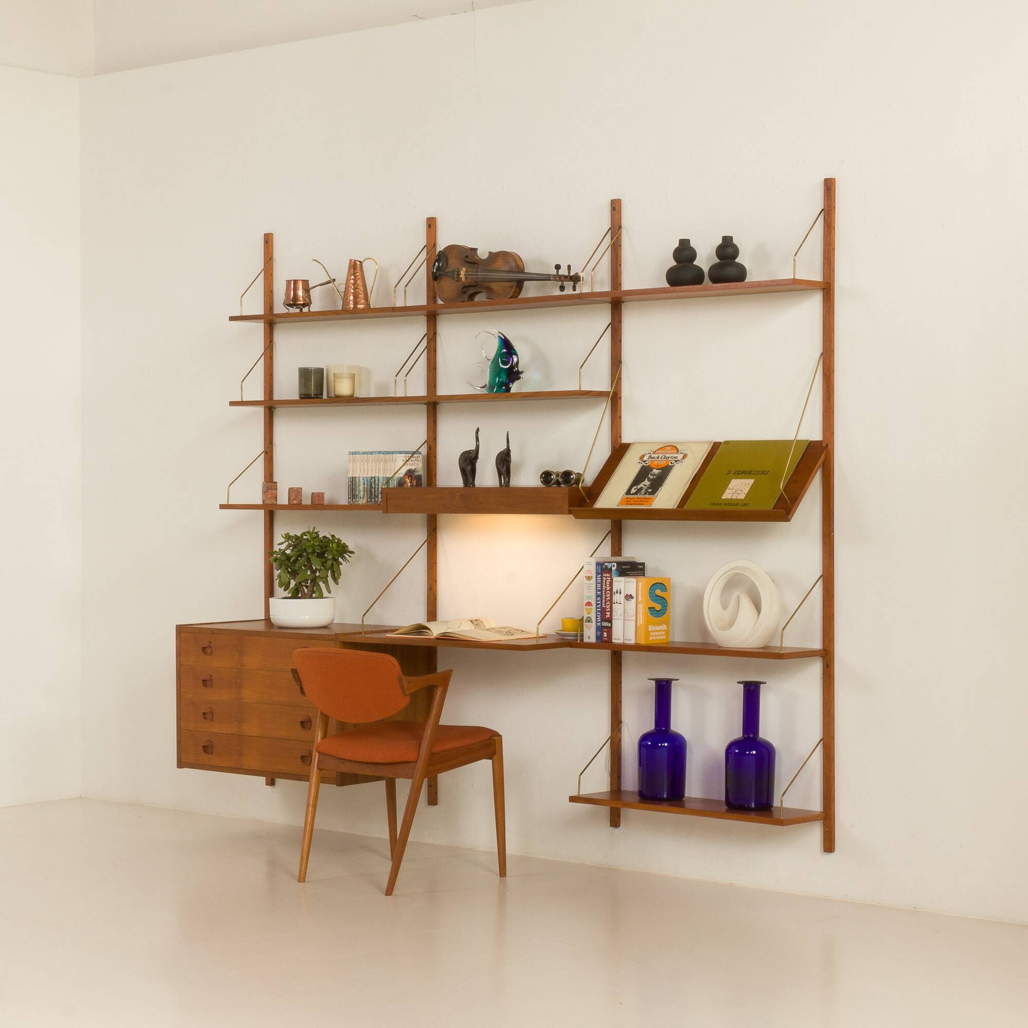 Danish teak wall unit in the style of Cadovius, Sorensen with a lamp, 1970s