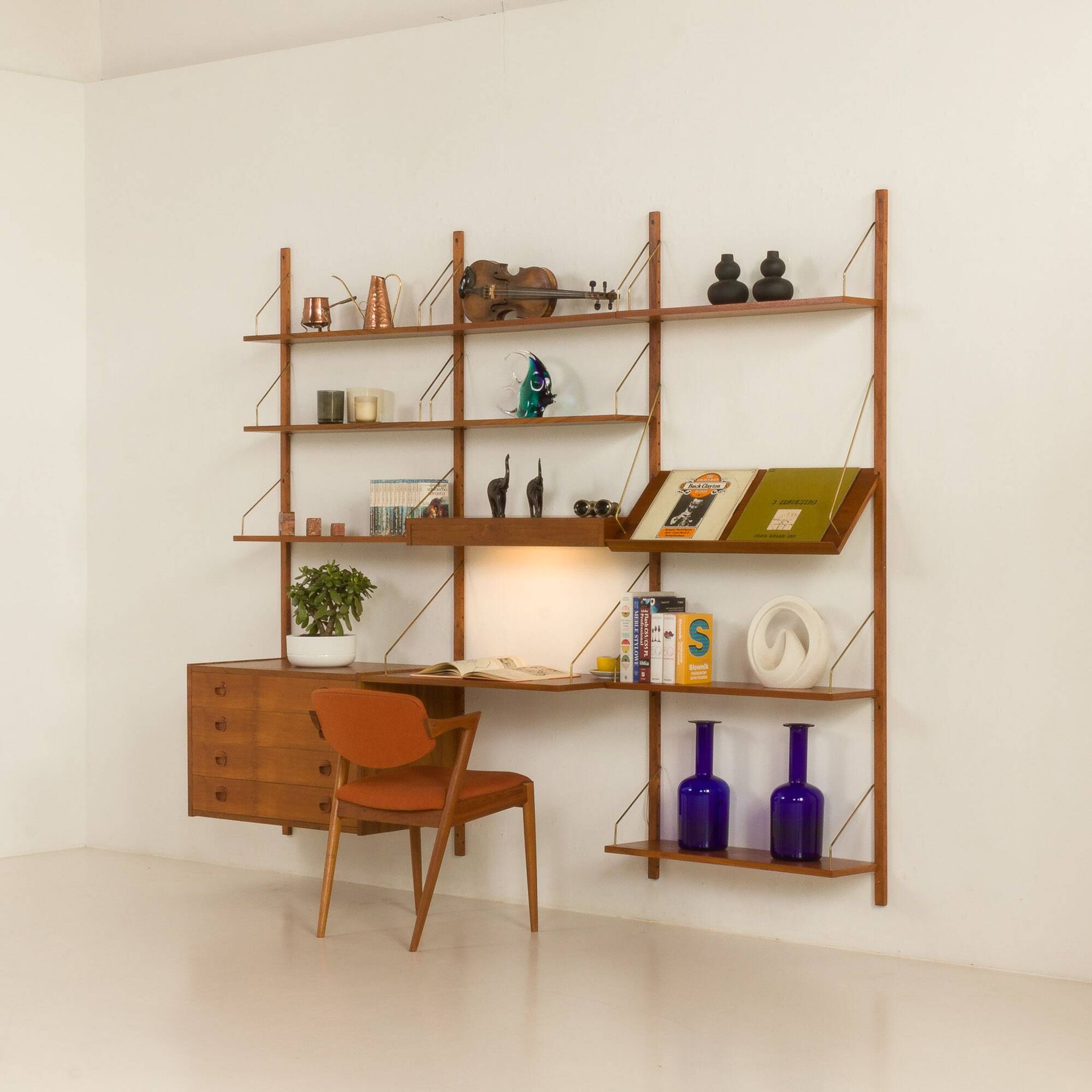 Danish teak wall unit in the style of Cadovius, Sorensen with a lamp, 1970s