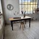 Oak farmhouse table with turned black legs.