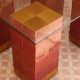 Modern coffee table in burgundy zellige with a tempered glass top.