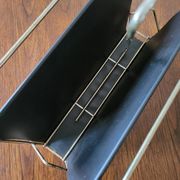 Vintage metal magazine rack in gold and black vinyl Newspaper holder