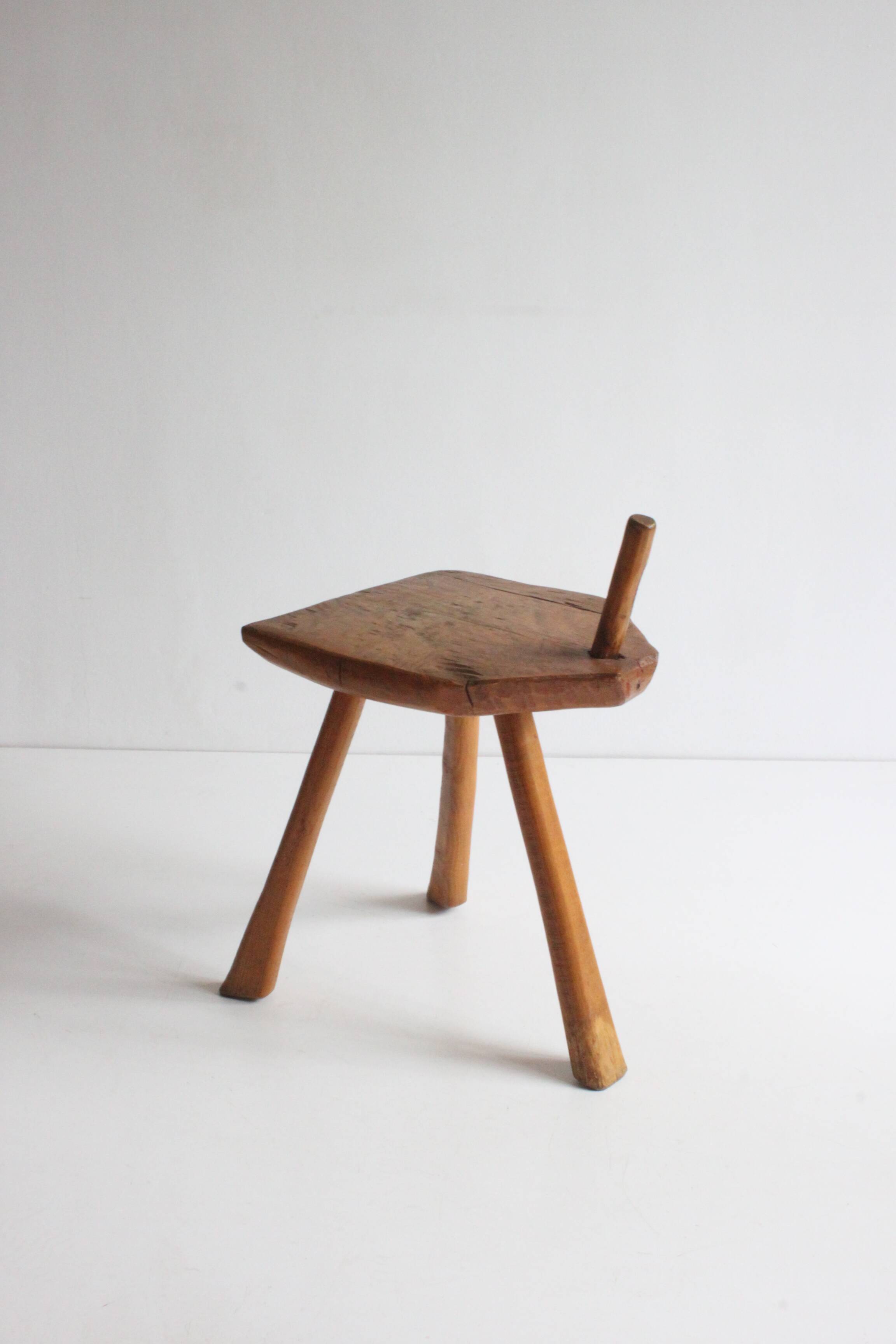Brutalist tripod stool in carved wood, 1950s