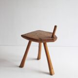 Brutalist tripod stool in carved wood, 1950s