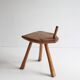 Brutalist tripod stool in carved wood, 1950s