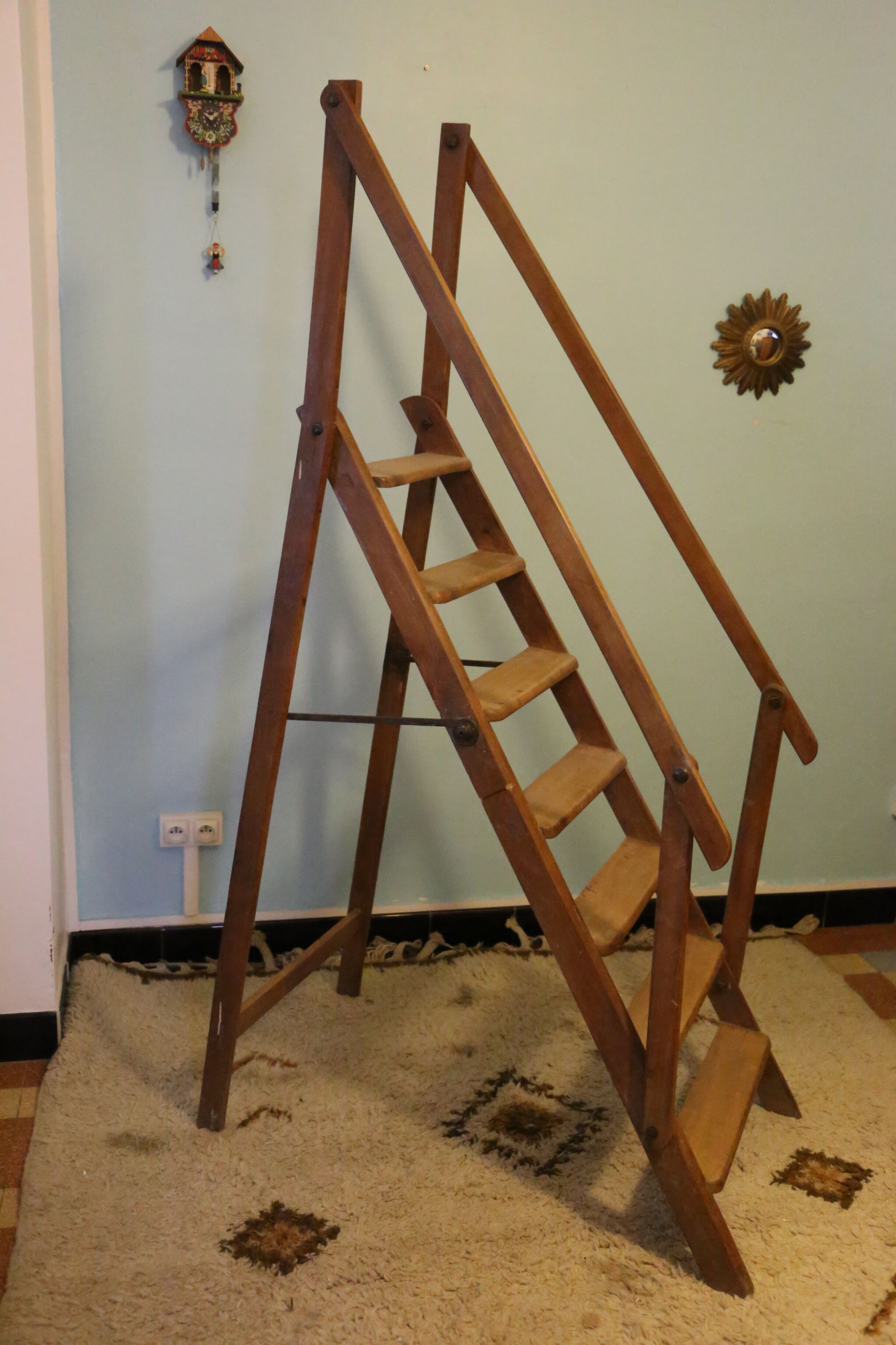 Old wooden stepladder with bodyguards
