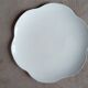 Large white multi-lobed pie or cake dish