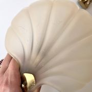 Pair of vintage shell glass wall lights, Art Deco style fixtures.