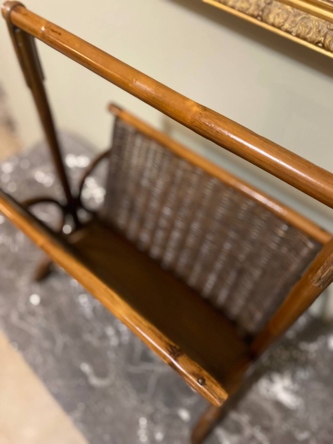 Wicker and brown wood magazine rack