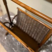 Wicker and brown wood magazine rack