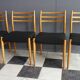 Set of 4 dining chairs in wood and black fabric 1960s