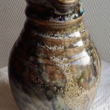 Enamelled ceramic pitcher, signature mb the terminal
