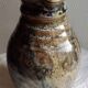 Enamelled ceramic pitcher, signature mb the terminal