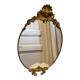 Antique bronze oval mirror