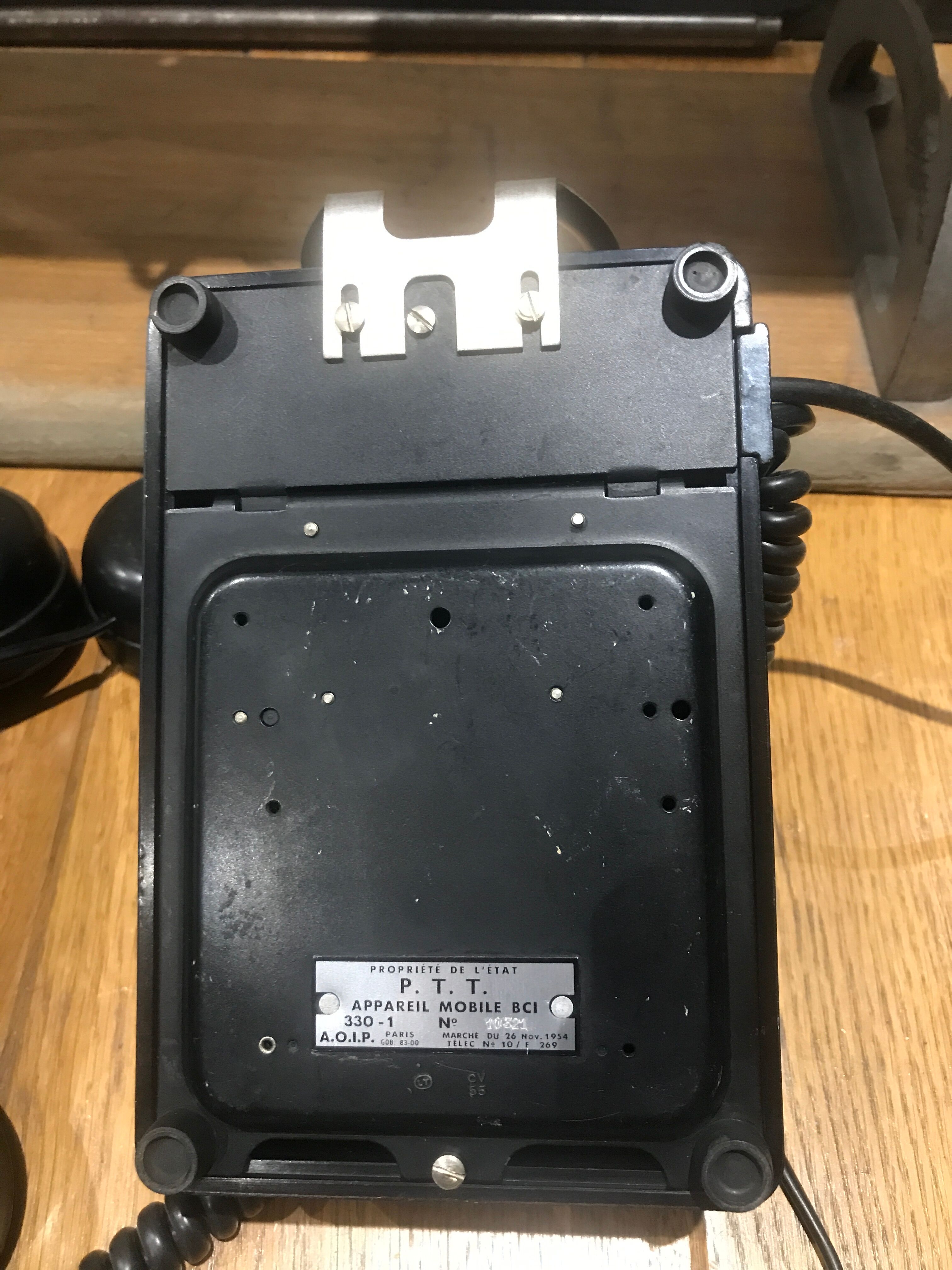 Black bakelite dial telephone with support