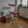 Vintage folding chair in red faux leather with a chrome frame.