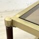 Vintage 1970s gold metal and smoked glass coffee table.