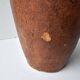 Terracotta face sculpture in African art style
