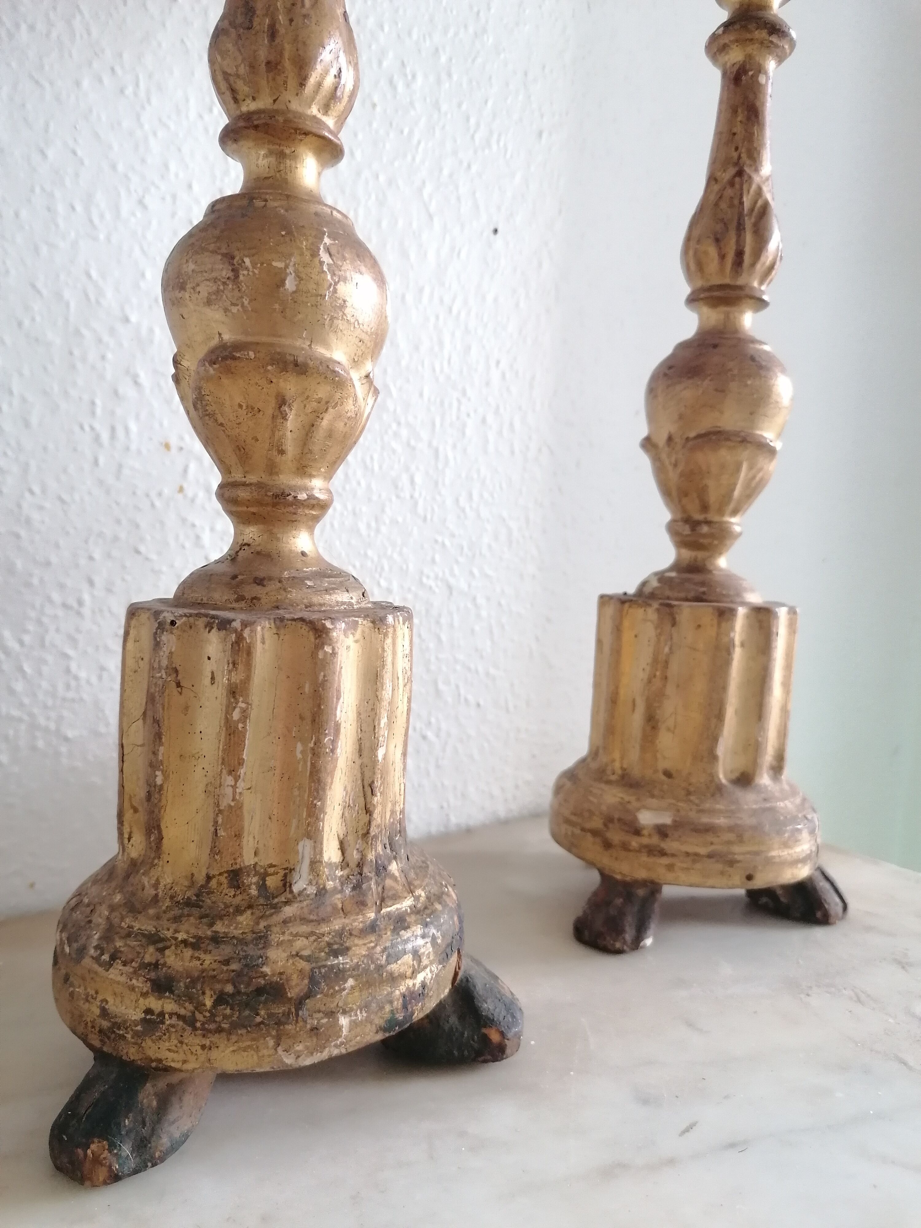 Pair of gold candlesticks with leaf