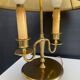 Directoire style bouillotte lamp in brass with double lights.
