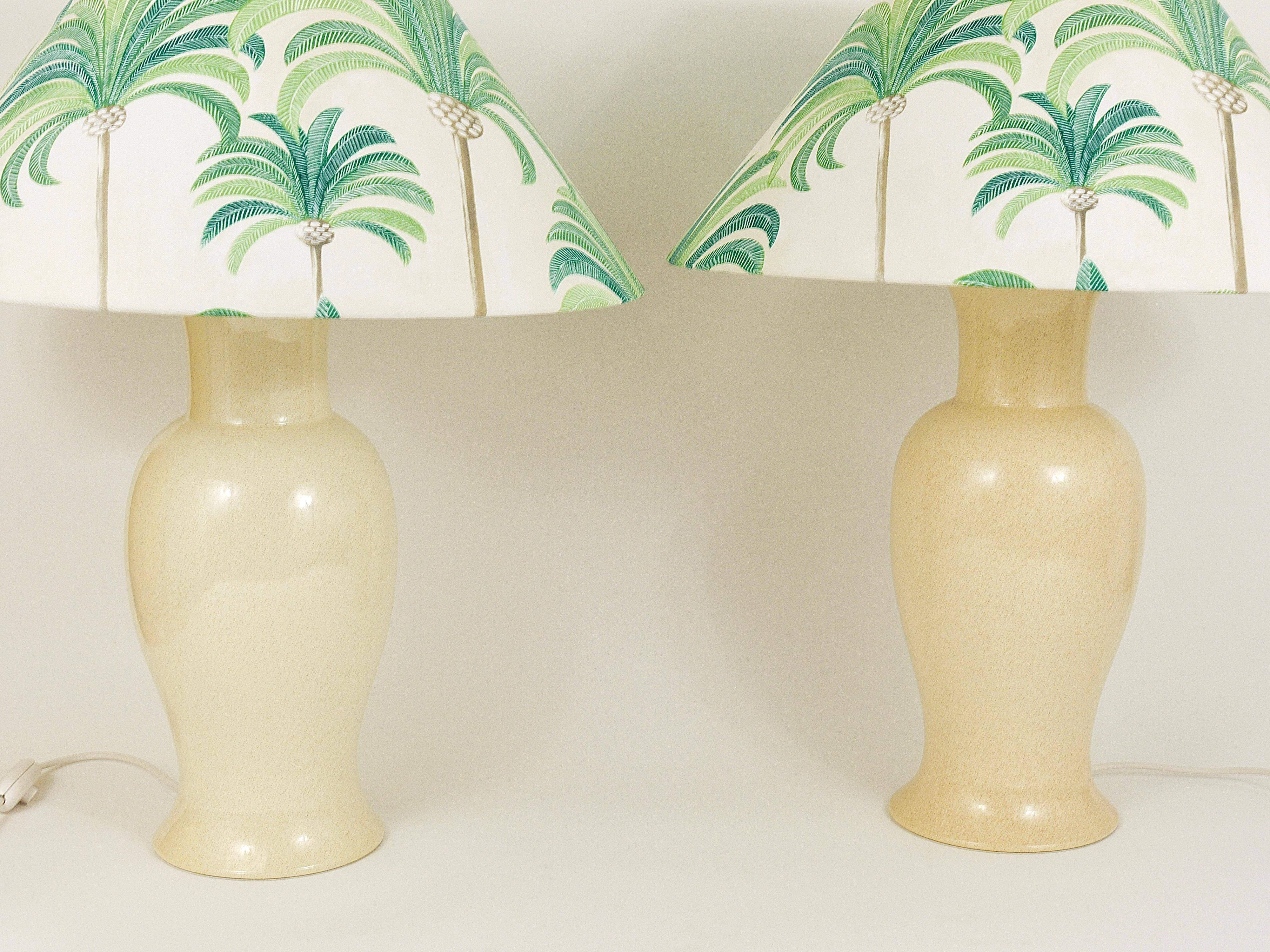 Pair of Tommaso Barbi Riviera palm tree table lamps from the 1970s with matching cushions.