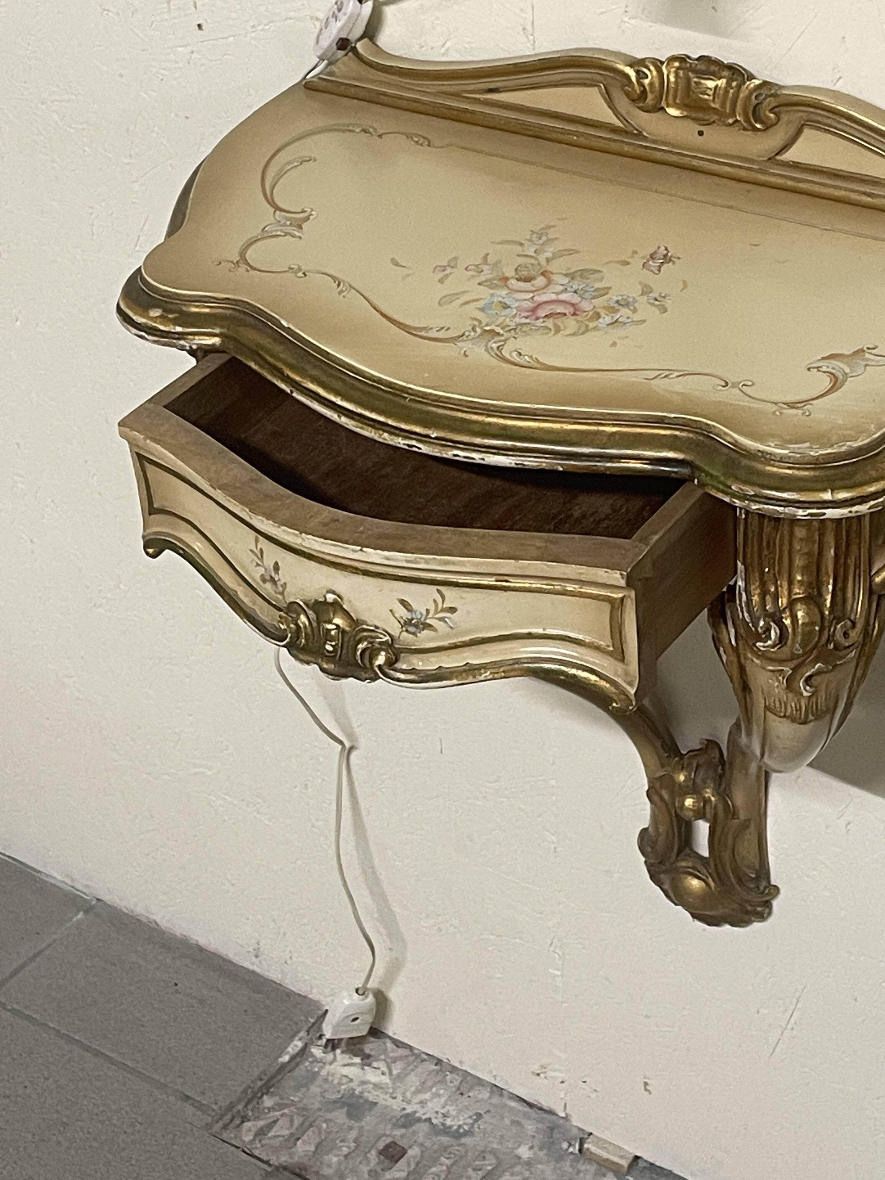 Pair of wall-mounted consoles with a mirror in Louis XV style.