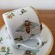 Cup and saucer in porcelain Henriette Bee pattern