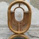 Magazine rack in braided rattan of the 60s