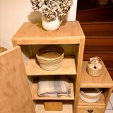 Asymmetrical cabinet made of raw wood