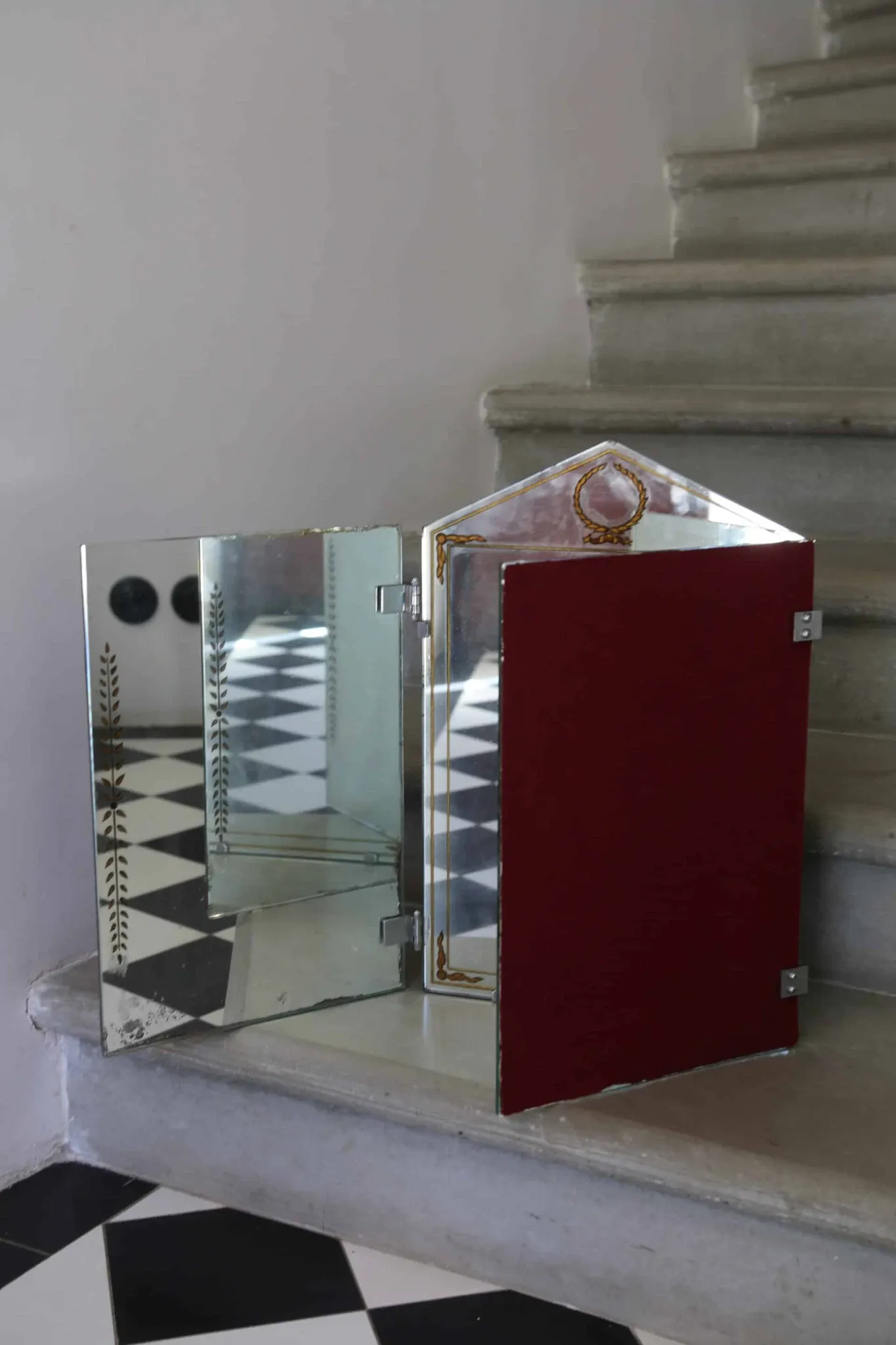 Triptych mirror with eglomisé and pediment, 1940s-50s