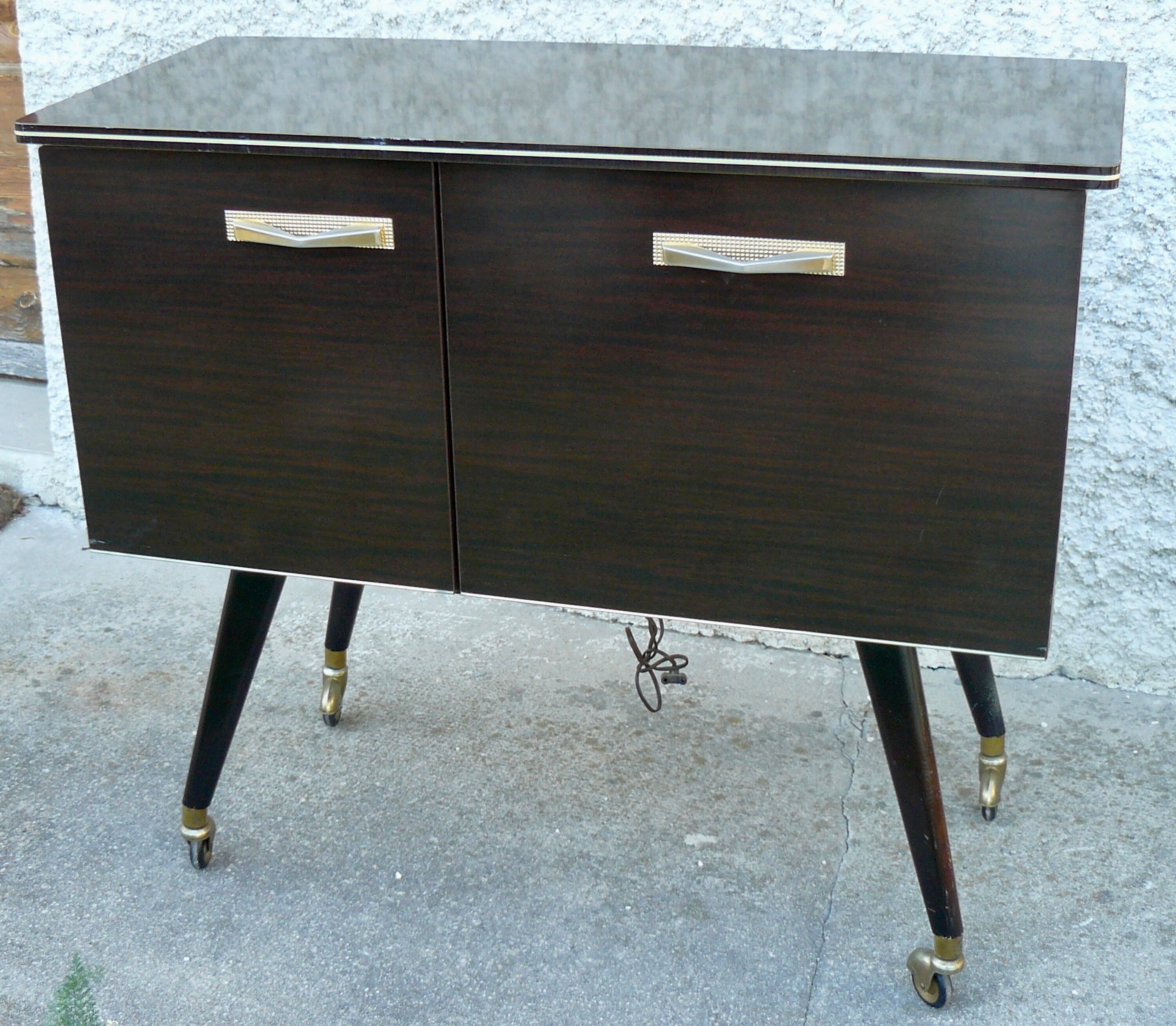 Vintage 1960s rolling and lighting bar with compass legs