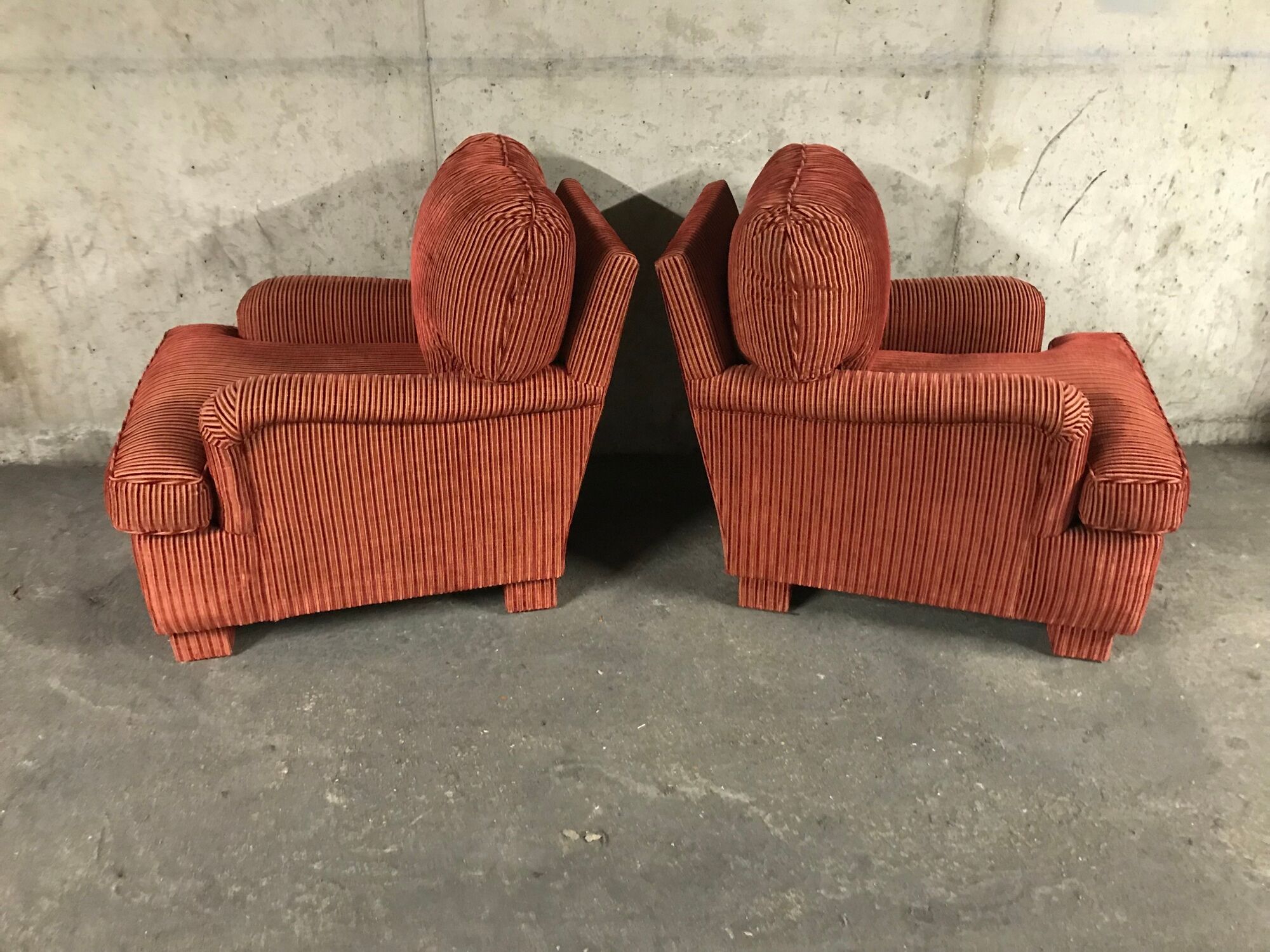 Pair of club in red velvet armchairs Yves Halard