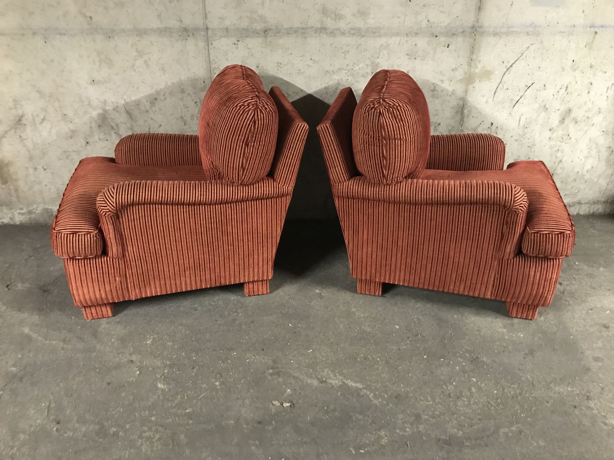 Pair of club in red velvet armchairs Yves Halard