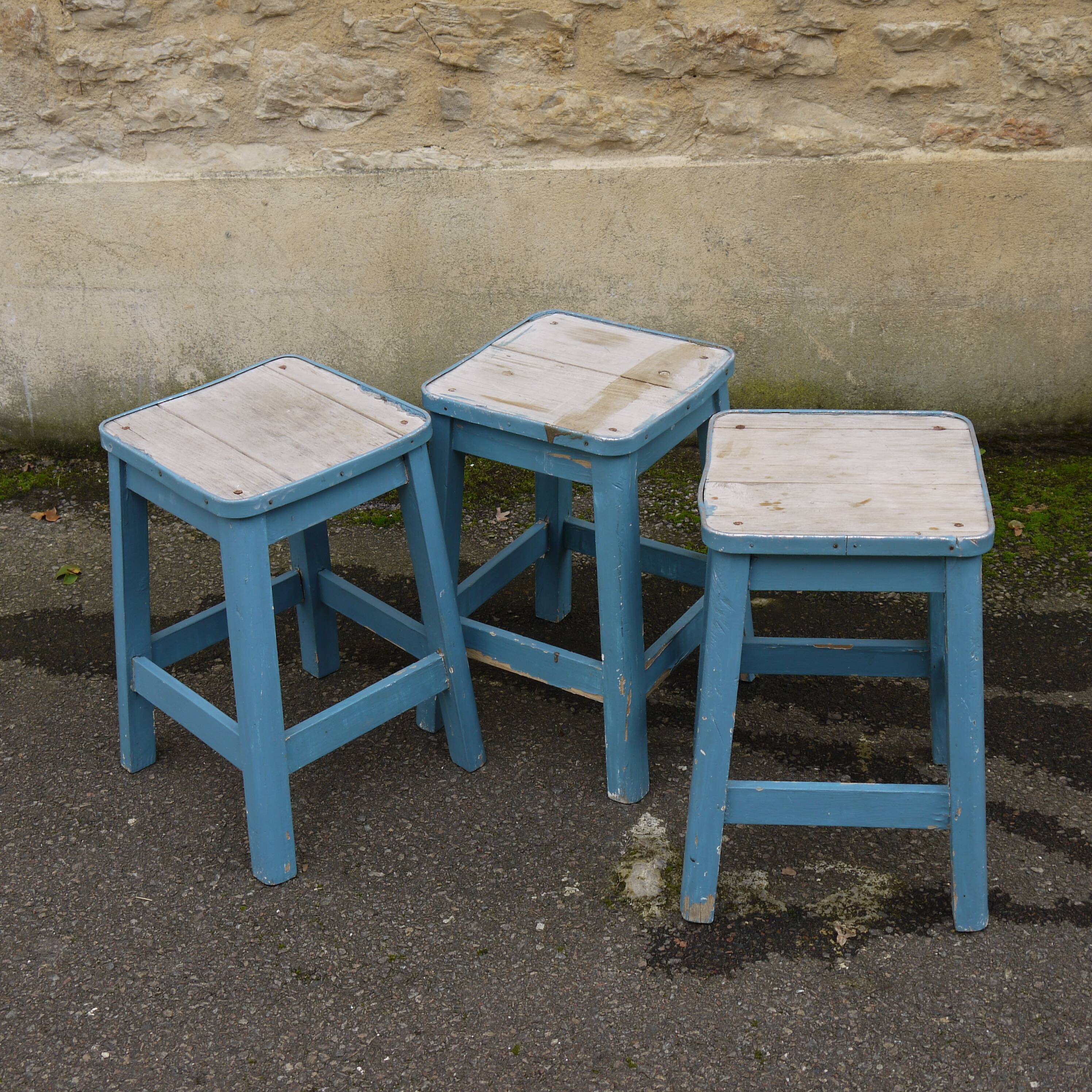 Three blue wooden stools