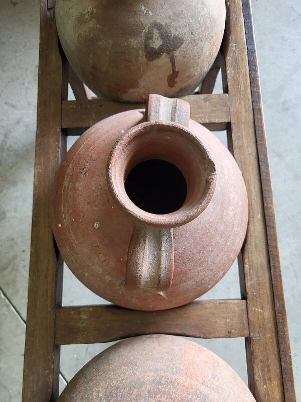 Old wooden jar holder with 3 clay jars