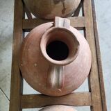 Old wooden jar holder with 3 clay jars