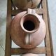 Old wooden jar holder with 3 clay jars