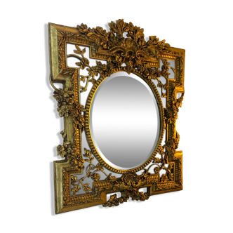 Antique mirror with gold leaf parecloses